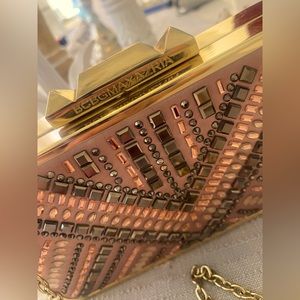 BCBG rhinestones clutch/with long chain attached.